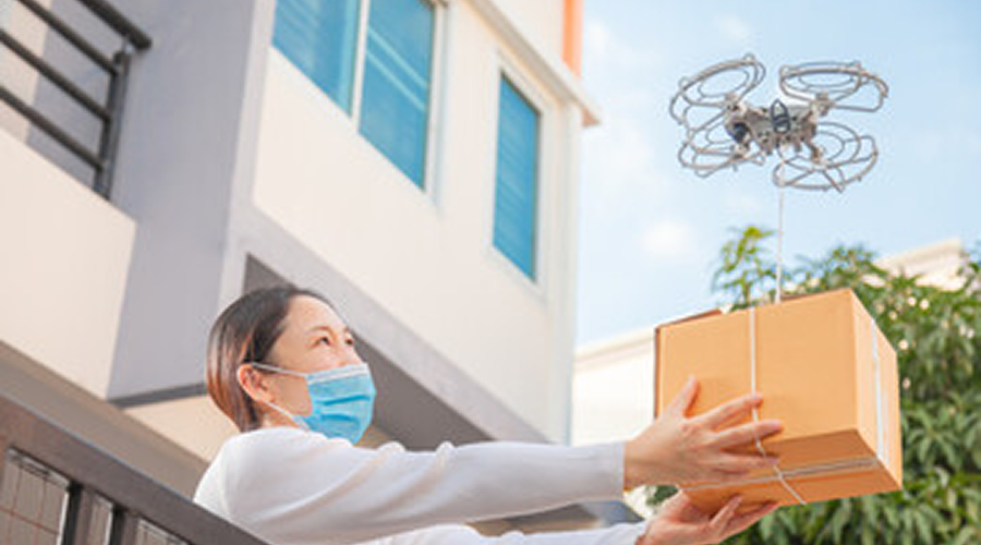 Drone delivery to woman with mask